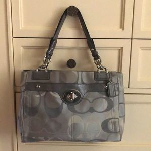 Gray Coach purse.